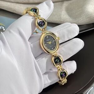 Anthropologie Gold Bracelet Watch with Black Dial and Iridescent Accents